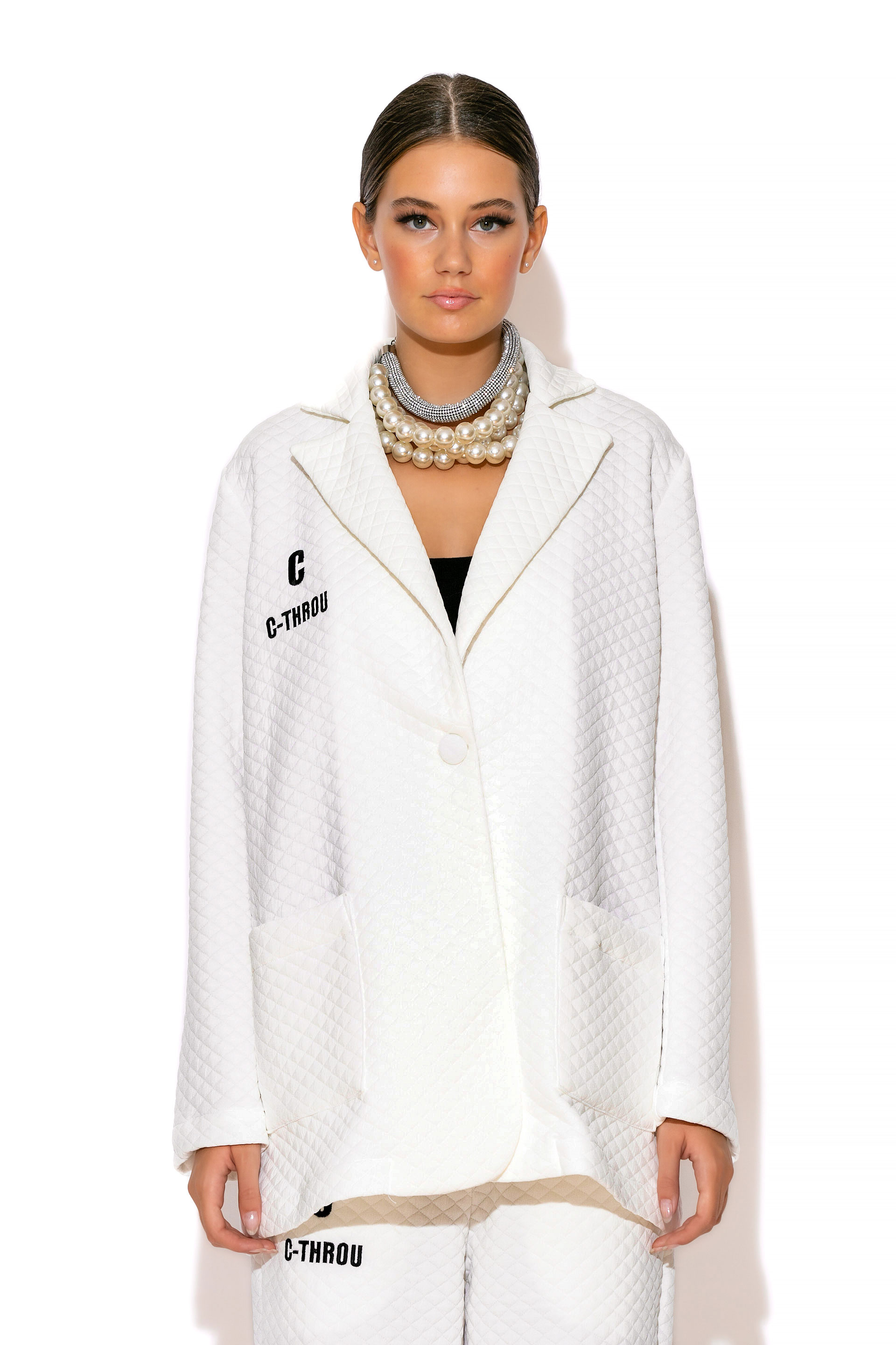 C-THROU Quilted Logo Embroidered Oversized Single-breasted Jacket with Classic lapel and front pockets is perfect for anytime wear.