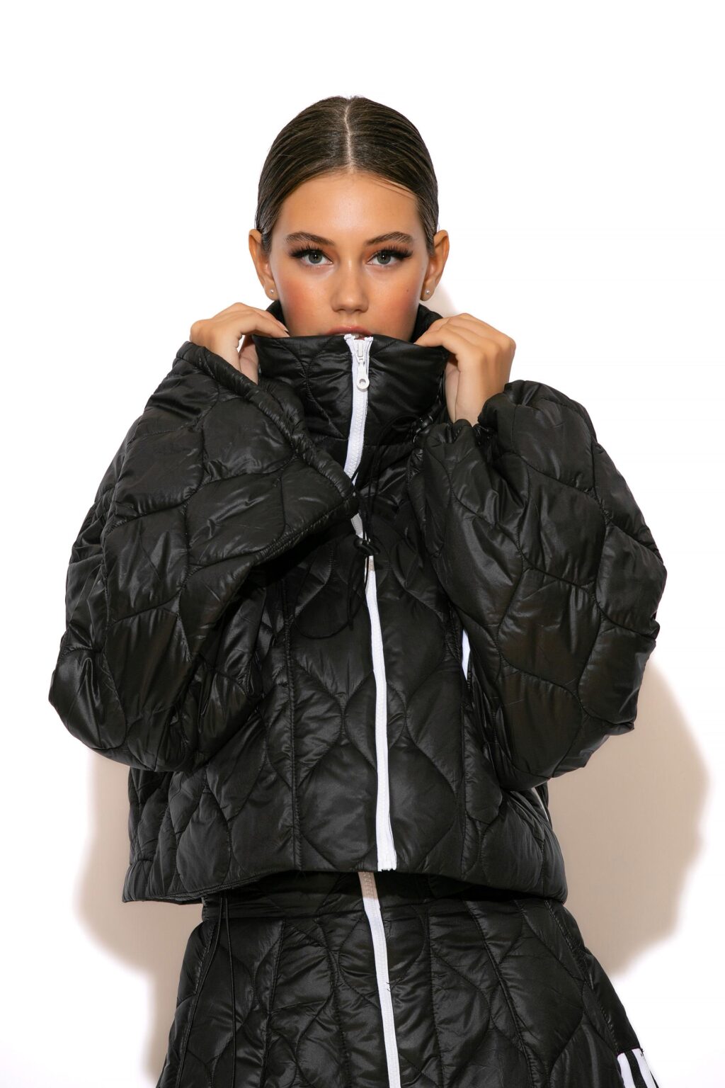 C-THROU Quilted shell High Collar Puffer Jacket with Long Wide Drawstring Sleeves and Front Pockets Unlined combines elegance and comfort.